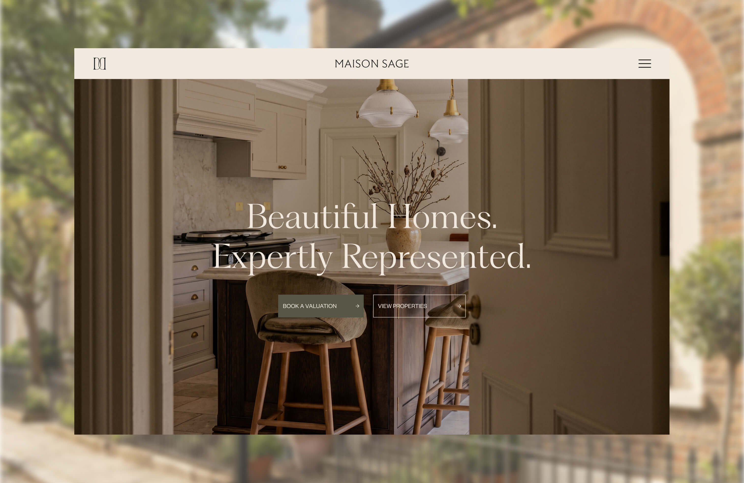 A screenshoot of the Maison Sage home page set against blurred background image of a row of townhouses on a sunny day.